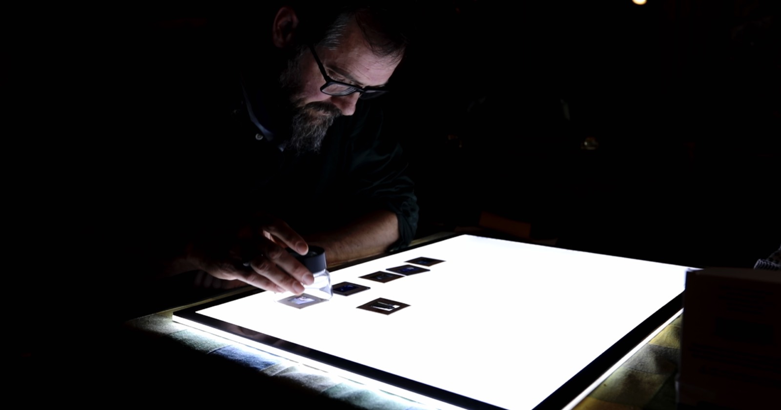 Family photographic slides on a light table